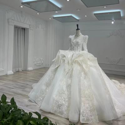 China The latest temperament trailing transparent long-sleeved high v-neck pure white lace pattern long train wedding dress for sale