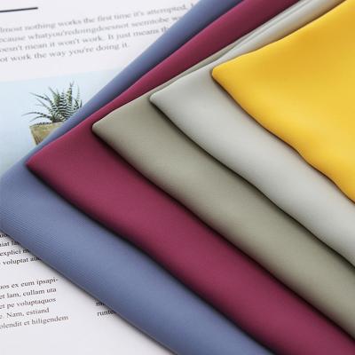 China Factory Price Sustainable Soft Crystal Shiny Heavy Satin Fabric Cloths 100 Polyester Lining Fabrics For Sleepwear for sale