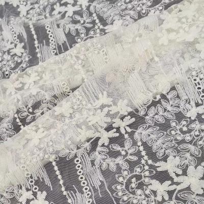 China Cheap White Bridal Water Soluble Mesh Embroidery Tulle Private Label Wedding Dress Lace Net Fabric for sale