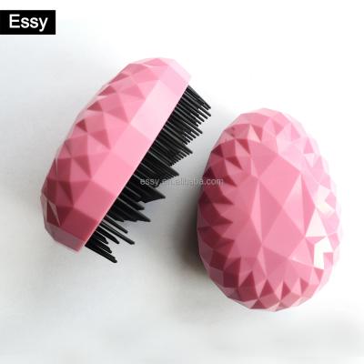 China Compact Diamond Surface Egg Shaped Plastic Hair Brush No Tangle To Relieve Detangling Hair Brush for sale