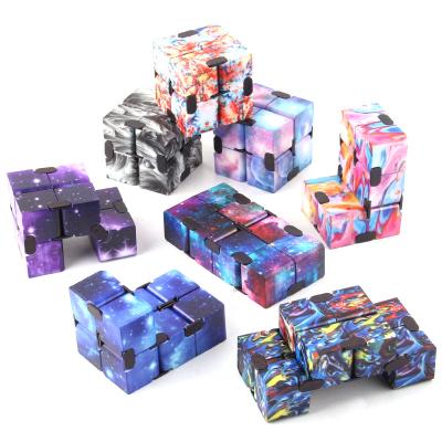 China Mini Wholesale Funny Educational 3d decompression galaxy metal infinity fidget person bending magic cube alloy finger toys trigger for sale