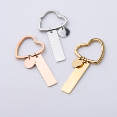 China Fashoin Stainless Steel Heart Shape Custom Bar Anti-lost Phone Cell Phone Number Lettering Male And Female Car Keychain Pendant for sale