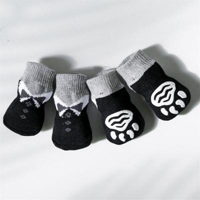 China Breathable Black Terry Knitted Anti Slip Dog Socks Viable Protective Paws Cartoon Cushion Adorable Dog Socks With Foot Glue for sale