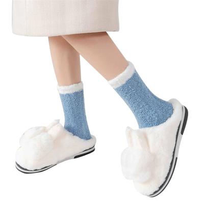 China New Pure Winter Fuzzy Soft Warm Polyester Cozy QUICK DRY Spell Color Stocks Thick Ladies Coral Fleece Floor Socks Twist Design for sale