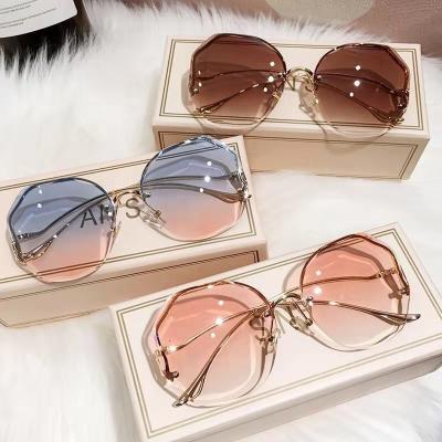 China European and American edge polygon 2021 fashion women's rimless cut UV protection sunglasses for sale