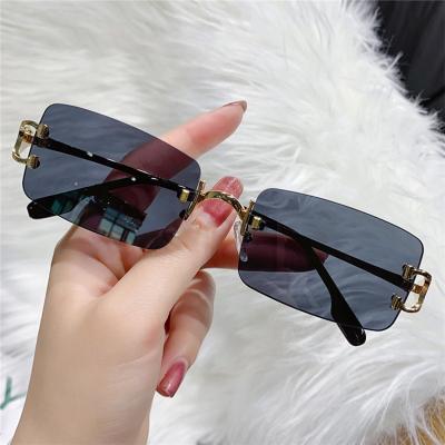 China Small Square Fashion Frame Cut Ocean Glass UV400 Glass Trend Brand Designer Rimless Sunglasses New for sale