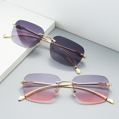 China Retro Rimless Rimless Glasses 2022 New Brand Designer Small Frame Popular Women UV400 Sunglasses for sale