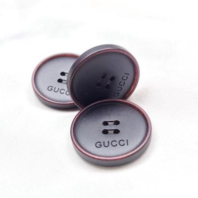 China Sustainable custom resin branded buttons for clothing and jeans and shirt sew button accessories unsaturated polyester resin button for sale