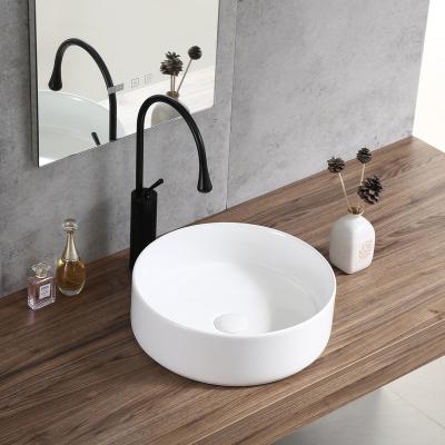 China Good Selling Modern Supplier Ceramic Table Top Wash Basin Round White Bathroom Basin Sink for sale