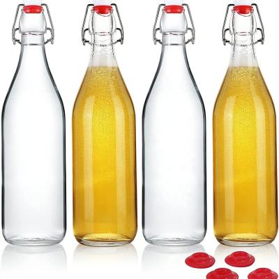 China Freshness Preservation Wholesale Clear Glass Bottle With Airtight Cap For Beer And Wine for sale