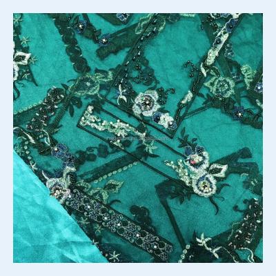 China Sustainable Gorgeous Dark Green African Handmade Sequins Beaded Lace Fabric Dress Dress Lace Fabric Wholesale for sale