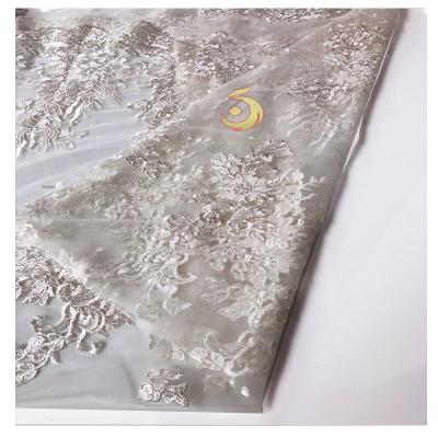 China Flat White French Bridal Lace Embroidery Wedding Dress Fabric Viable Wholesale for sale