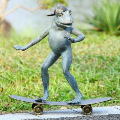 China Roller Skating Hand Carved Frog Statue Best Modern Design Funny Garden Sculpture for sale