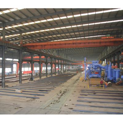 China Low Cost Clear Span 36m Modern Prefab Hangar Workshop Steel Frame Building for sale