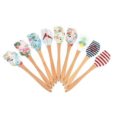 China Viable Heat Resistant Colorful Baking Pastry Cake Tools Non Stick Butter Silicone Spatula With Wooden Handle for sale