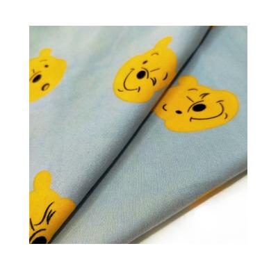 China Custom Light Blue Cartoon Bear Printing Shrink-Resistant Polyester Spandex Knit Fabric For T-shirt for sale