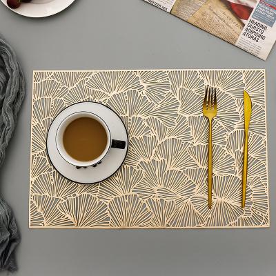 China 2021 Durable Restaurants And Kitchen Outleat PVC Place Cavity Pressed Foil Gold Place Mats For Kitchen Dining Table Mats For Decoration for sale