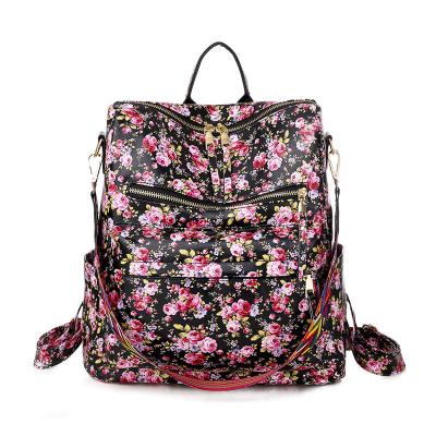 China Waterproof Women's Bags 2022 New Fashion Floral Clog Backpacks Female Single Handle Portable Bags Travel Large Capacity Backpack for sale