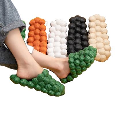 China Fashion trend 2021 new summer personality men bubble sandals and slippers women shape stepping on home shit sandals massage bottom slippers for sale