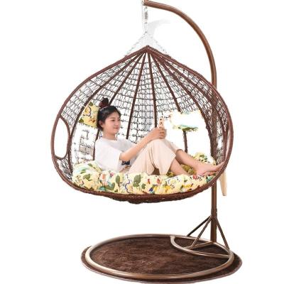 China Modern Outdoor Rattan Wicker Double Seat Hanging Egg Patio Swing Chair with Metal Stand for sale