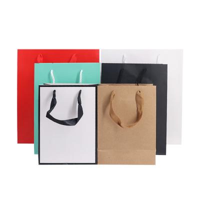 China Handmade Wholesale Recyclable Paper Bags And Kraft Paper Bags Kids Clothing Shopping Cartons for sale