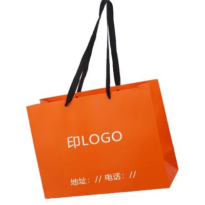 China Fashion Handmade Custom Logo Free Sample Luxury Pink Cardboard Paper Bag With Ribbon Handle for sale