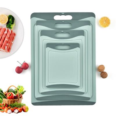 China Sustainable Plastic Sliding Set Cutting Board 4 Set Non Cutting Kitchen Board With Juice Grooves for sale