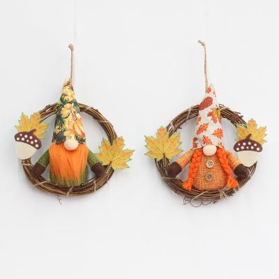 China Harvest Festival Decoration Faceless Figure Decorated Artificial Maple Leaf Front Door Thanksgiving Decor Autumn Home Garland for sale