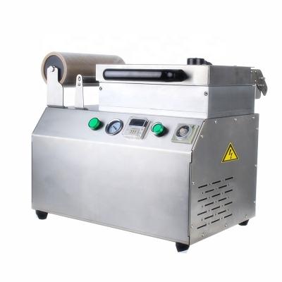 China Fish And Meat Table Type Filling Vertical Vacuum Air Press Packing Machine for Packing for sale