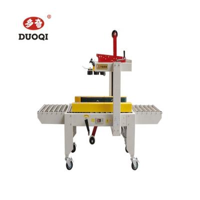 Chine Duoqi FXJ-4030S semi-automatique à gauche et à droite de conduite de la ceinture de ruban adhésif boîte de carton machine d'étanchéité à vendre