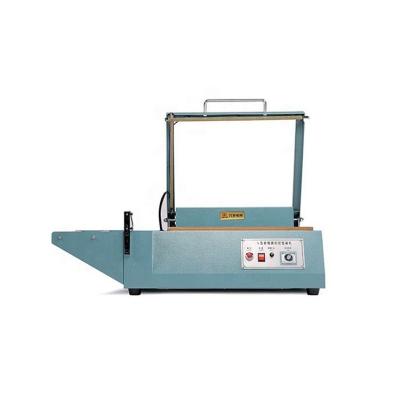 China DUOQI 380L Industrial L Bar Shrink Wrap Machine Household For Plastic Bags for sale