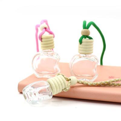 China Wholesale High Qiality Diffuser Irregular Shaped Empty Hanging Car Perfume Frosted Bottle With Wooden Cap for sale