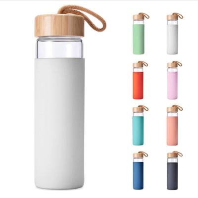 China Modern Hot Selling Home Outdoor Popular Tea Coffee Glass Water Bottle With Bamboo Lid And Silicone Cup Set for sale