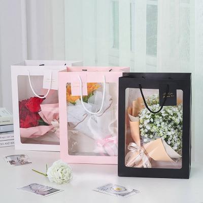 China Creative Recyclable Bouquet Handbag Bouquet Packaging Bag Large Gift Paper Bag With Window for sale