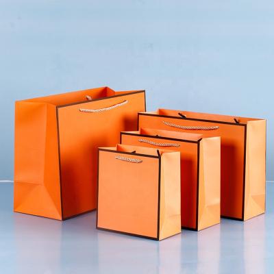 China Recyclable Wholesale Customized Logo Color Brand Luxury Boutique Packaging Gift Shopping Paper Bag for sale