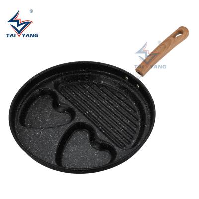 China Hot-selling New Chinese Style Four-hole Casserole Round Spanish Nonstick Egg Stir-fry Pan for sale