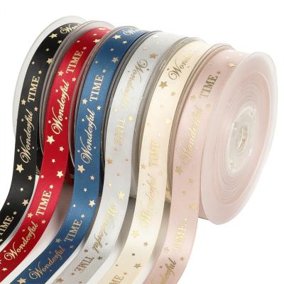 China Custom logo printed satin ribbon 25mm in high quality silk luster gold silver foil PANO for birthday gift wrapping for sale