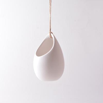 China Modern Ivory Ceramic Hanging Planter With Flat Bottom for sale