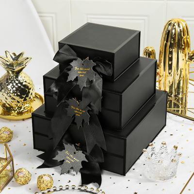 China Recyclable Wholesale Magnetic Black Paper Gift Box Clothing Brand Packaging Giftable Box For Clothes for sale