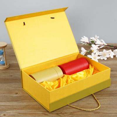 China Wholesale Printed Recyclable Logo Yellow Eco Friendly Tea Box Packaging Gift Box With Wrist Rope for sale