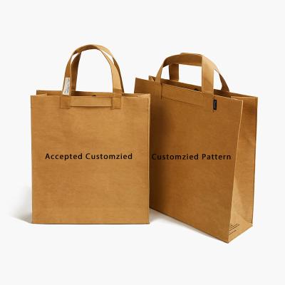 China Biodegradable Customize Biodegradable Fancy Shopping Paper Tote Bag Printing Christmas Gift Kraft Paper for sale