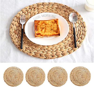 China Handmade woven wicker grass wicker wholesale viable french dining table corn rattan sea place mat sets for sale