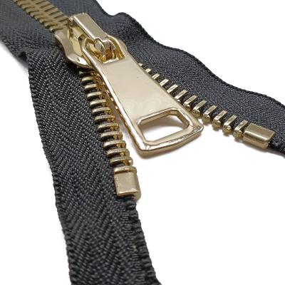 China Custom Fancy Metal Nickel Free #12 Zipper Continuous Supplier Supplied Gold Color Metal Plugged Light Zipper for sale