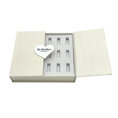 China Handmade Serum Cosmetic Packaging Box Essential Oil Packaging Box With 18 Slot Inserts for sale