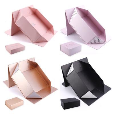 China Personalized Rigid Magnetic Foldable Gift Box Cardboard Packaging Box With Ribbon for sale