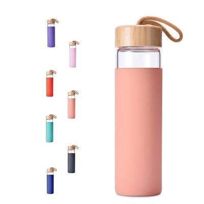 China Drinking Wholesale Simple Glass Water Bottle With Bamboo Lid And Silicone Sleeve Single Layer Glass Bottle for sale