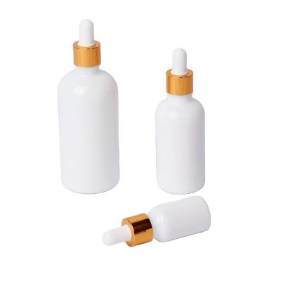 China Cosmetic Wholesale High Grade White Round Empty Essential Oil Amber Glass Dropper Bottle for sale