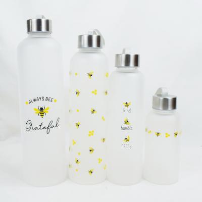 China 300ml 350ml 400ml 450ml 500ml stocked high borosilicate glass frosted water bottle with lid for sale