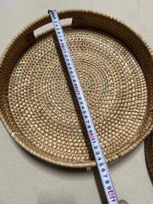 China Sustainable Handwoven Round Plastic Rattan Food Serving Tray for sale