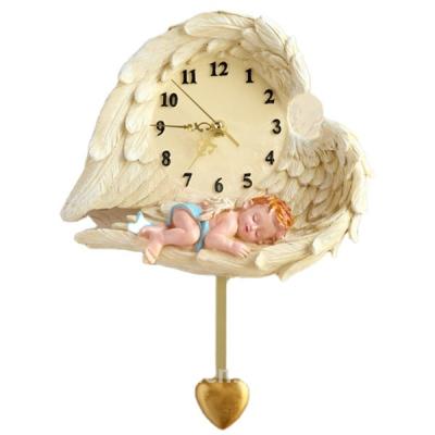 China Resin Style 3d Antique Baby Wing Decorative Pendulum Heart Shaped Wall Clock for sale